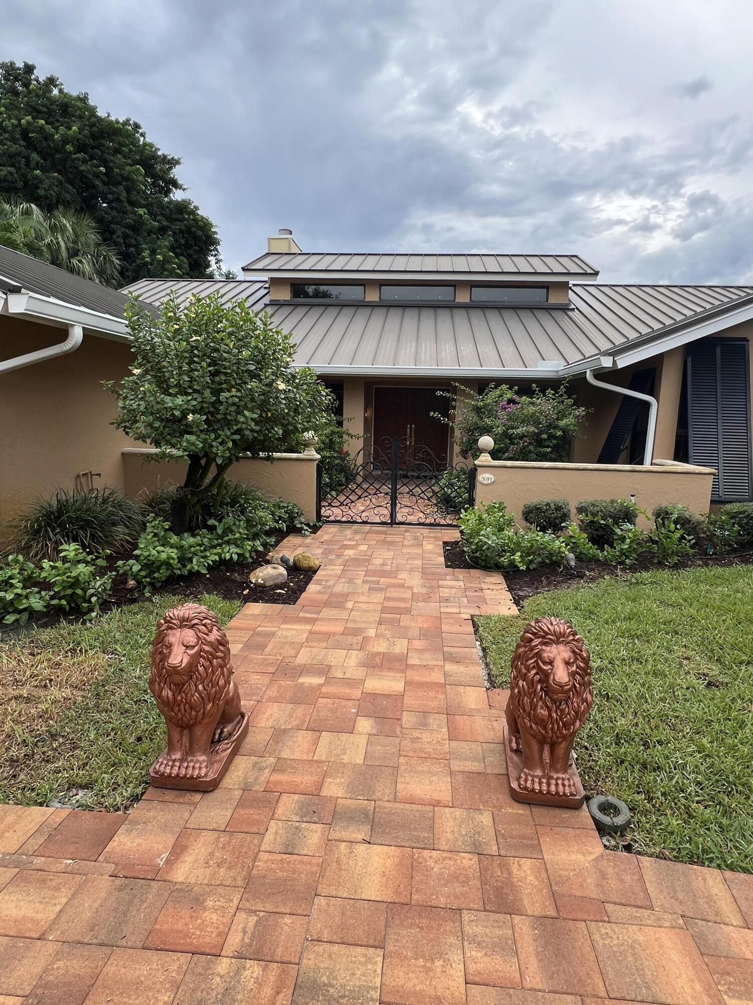 a front view of house with outdoor seating and yard