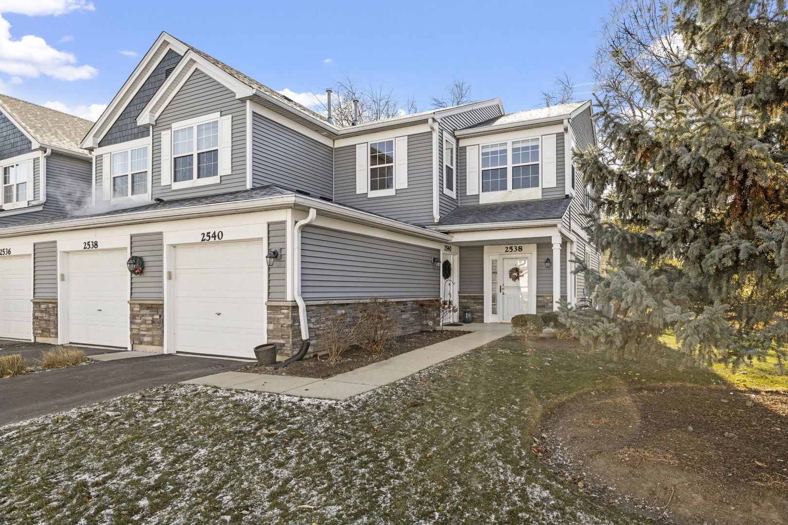 front view of a house with a yard