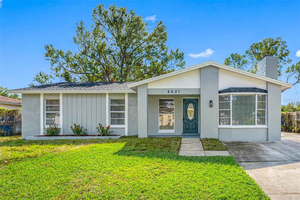 front view of a house with a yard