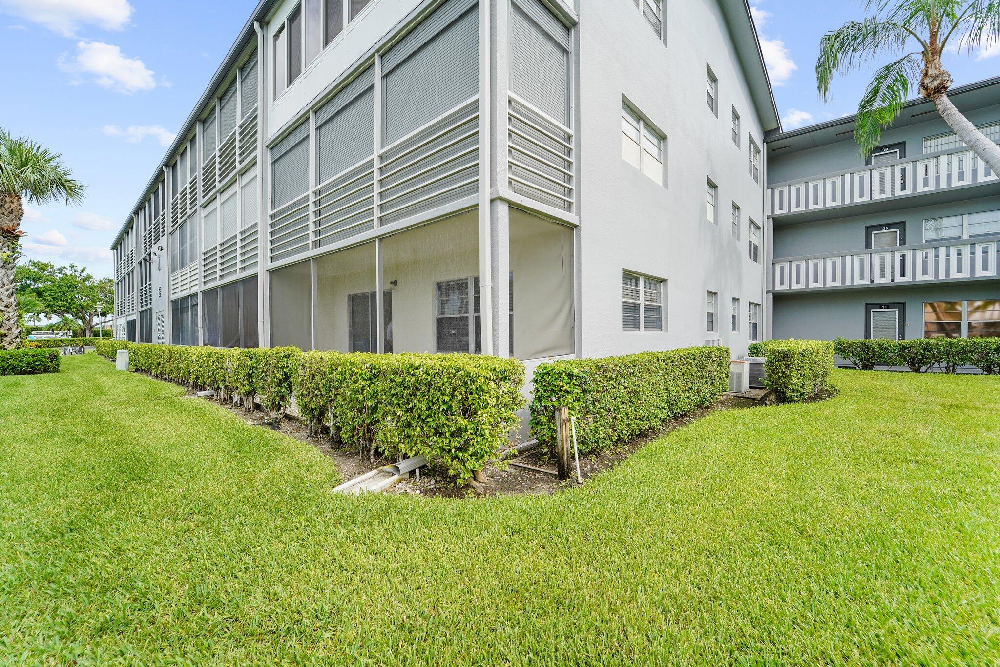 a view of a building next to a big yard