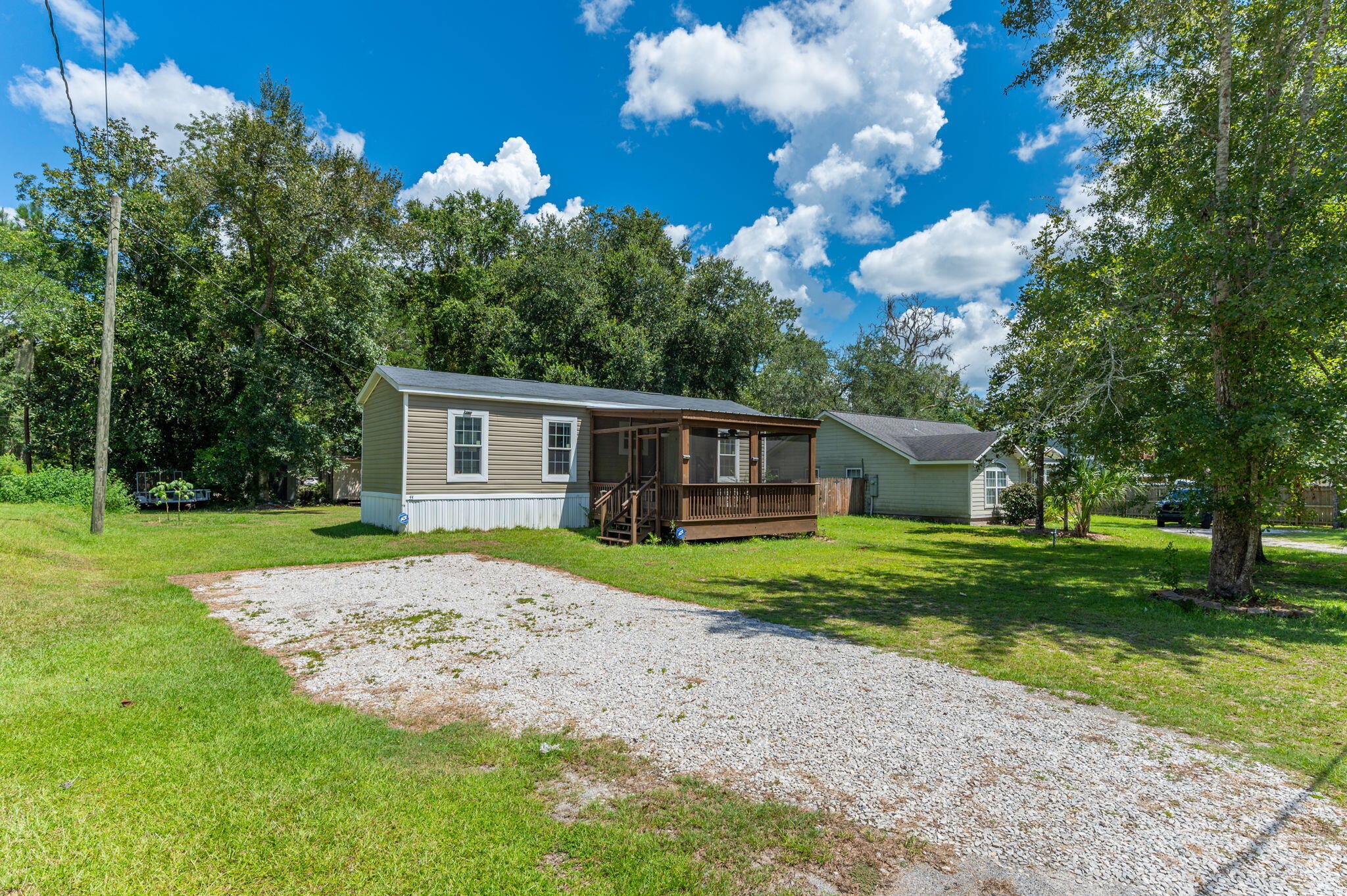 a view of a house with a backyard