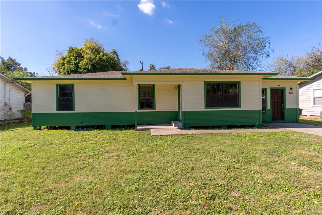 front view of a house with a yard