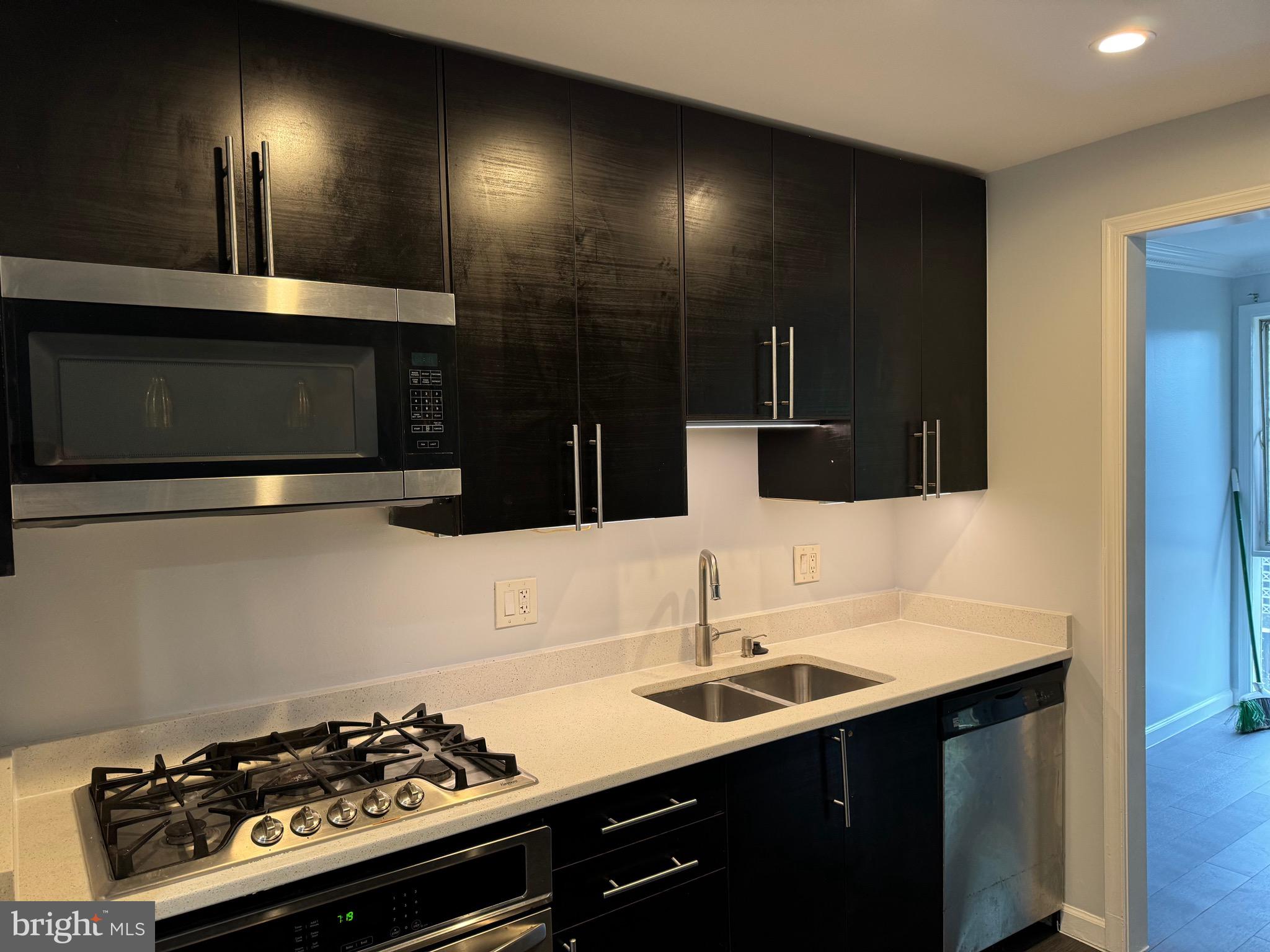 a kitchen with a sink and cabinets