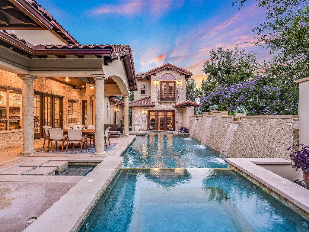 a view of a house with swimming pool