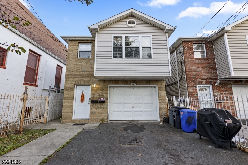 a front view of a house with parking space