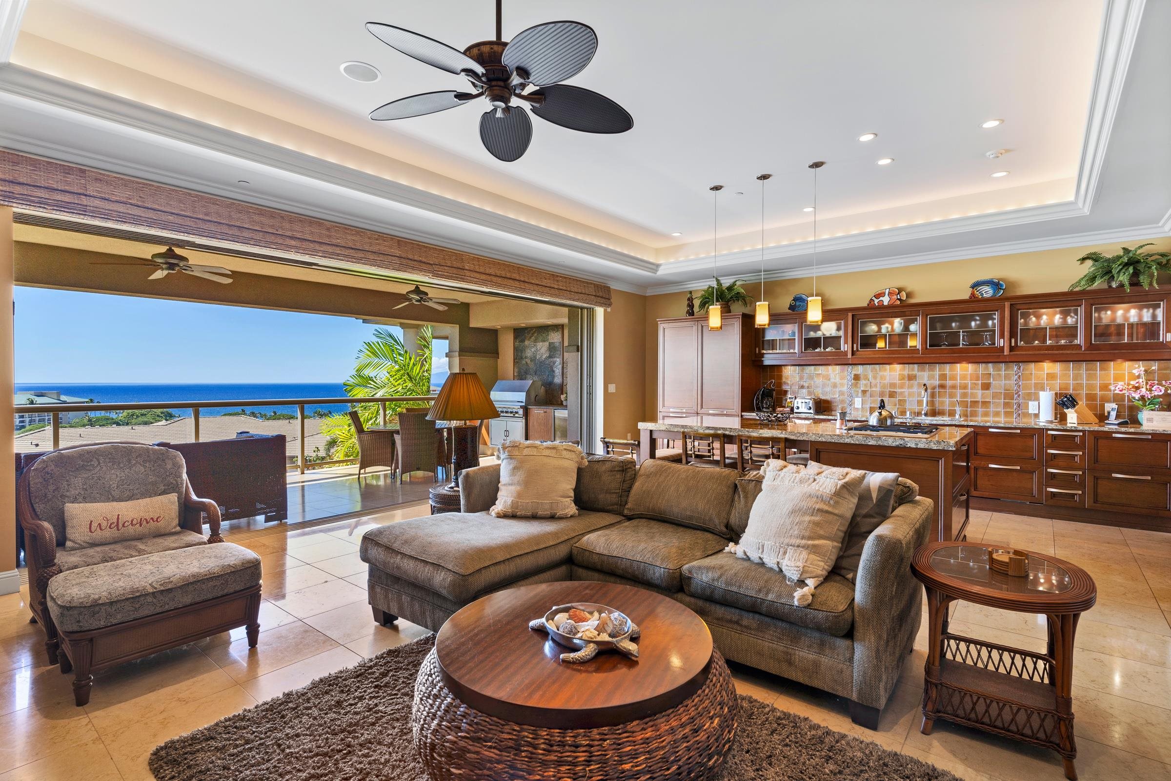 a living room with furniture a rug and a chandelier