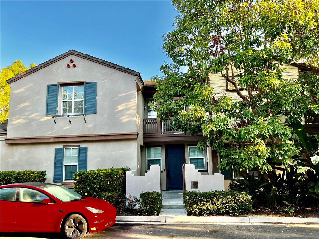 a front view of a house with parking space