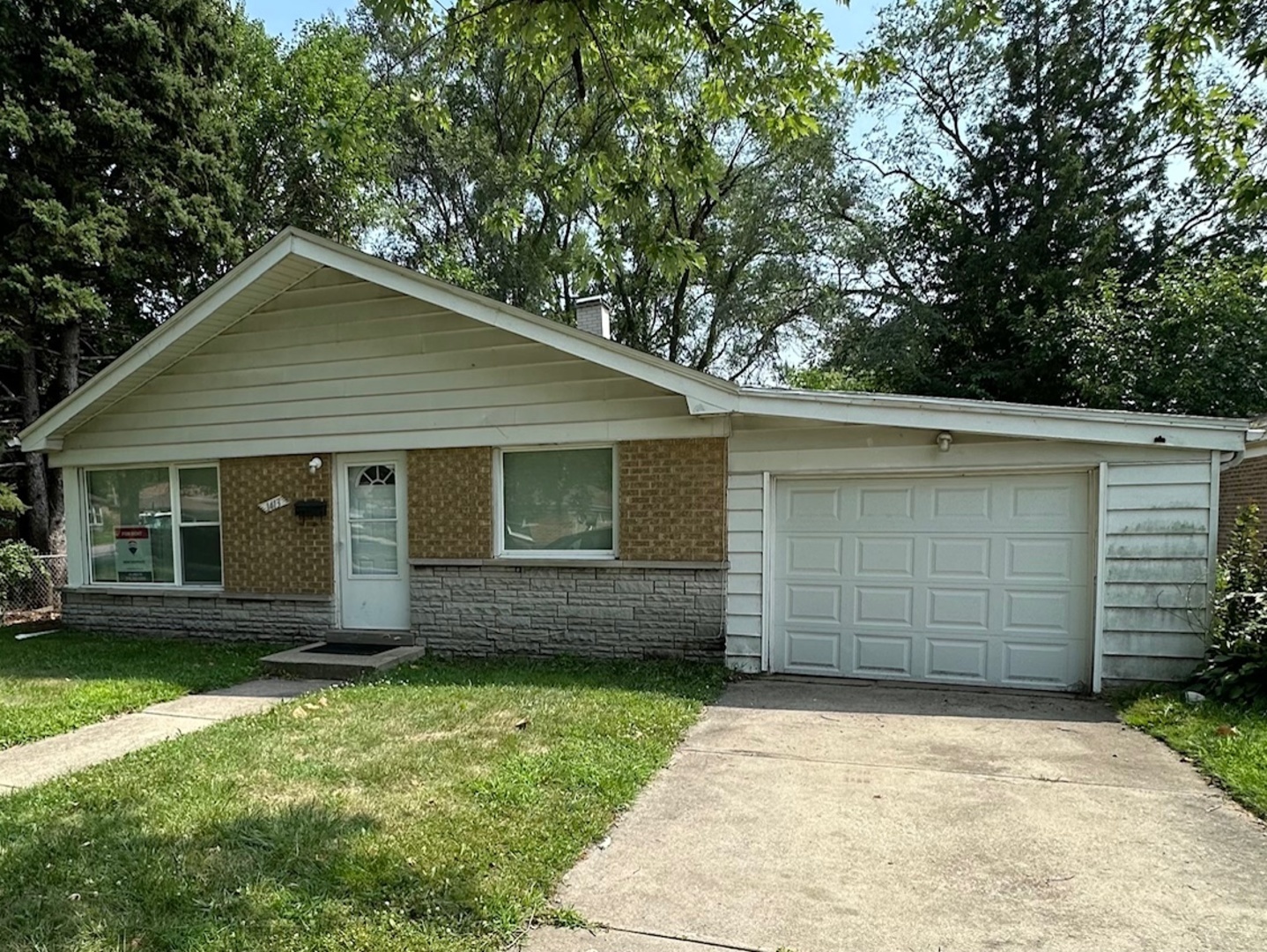 a front view of a house with a garage