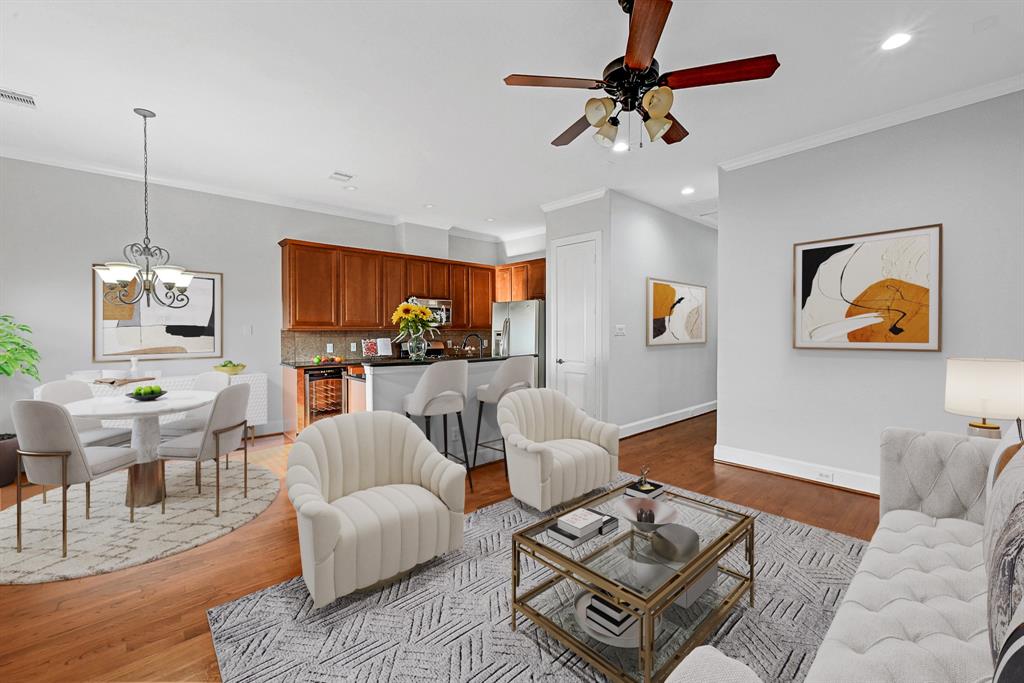 a living room with furniture a rug and a chandelier