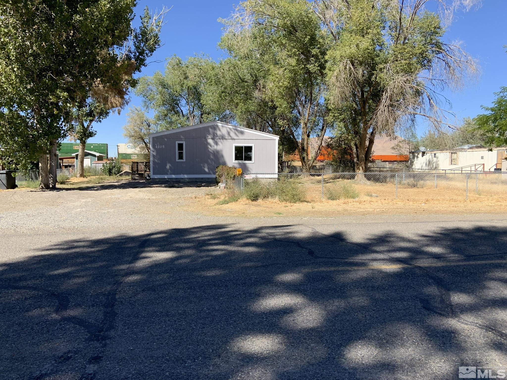 a view of the house with a yard