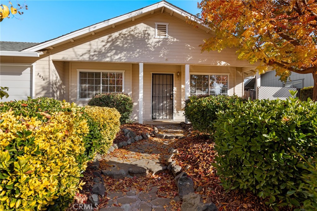 front view of a house with a garden