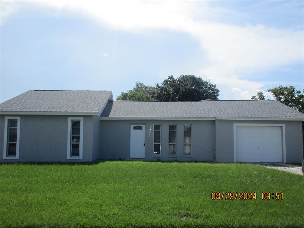 front view of a house with a yard