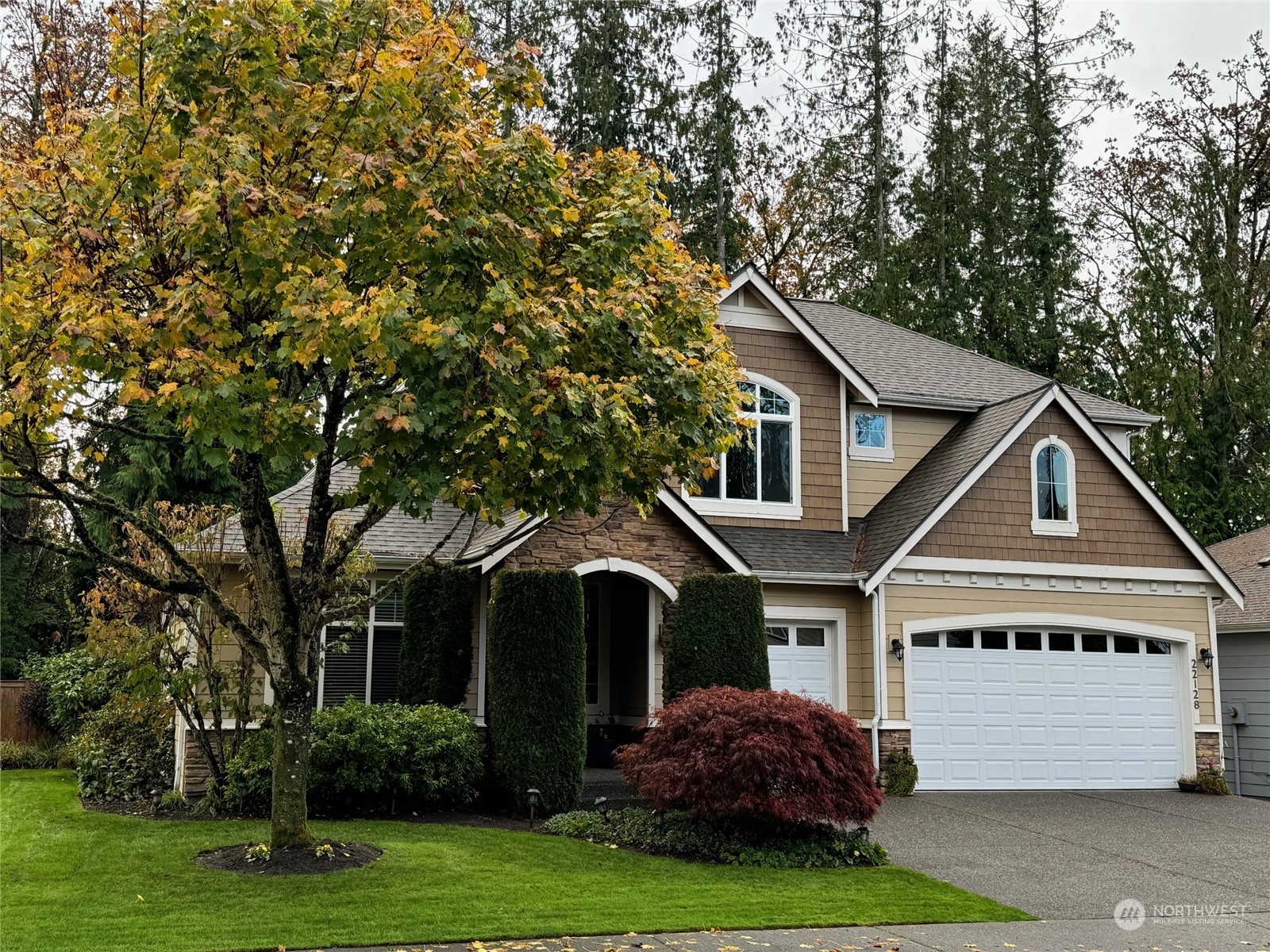 a front view of a house with a yard