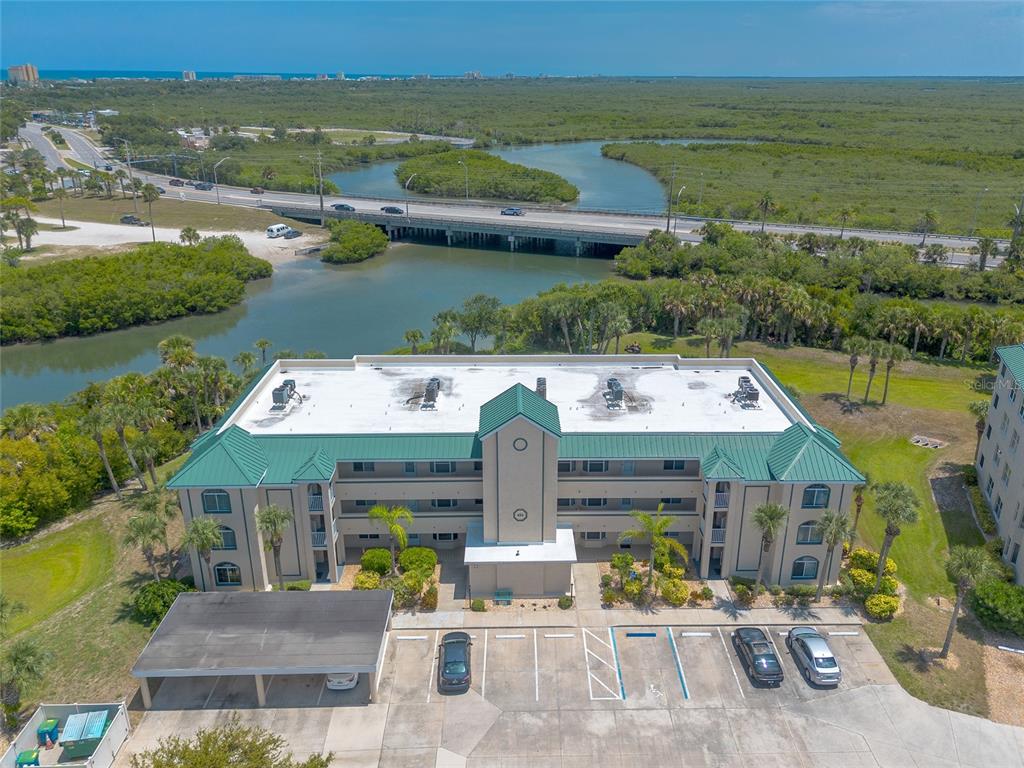 an aerial view of a house with lake view