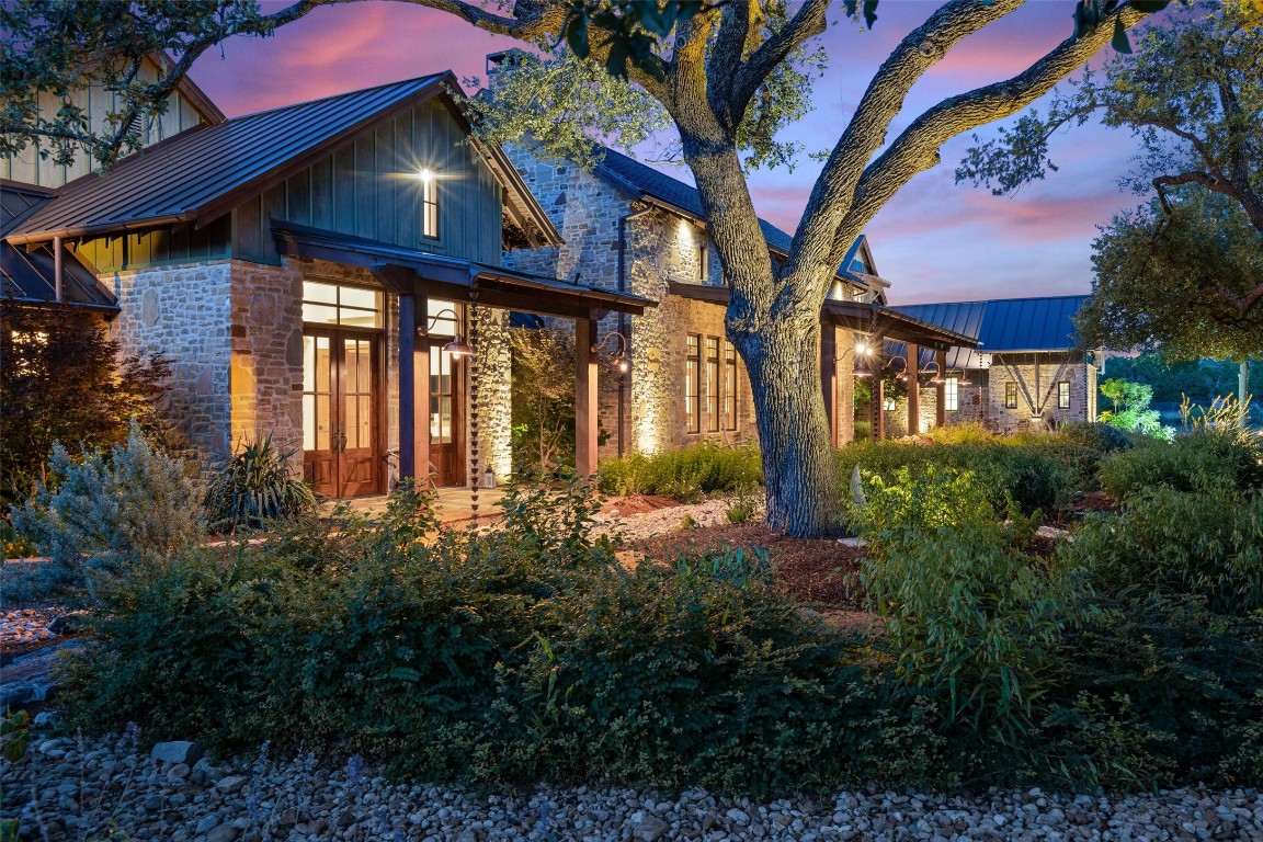 a front view of a house with lots of green space