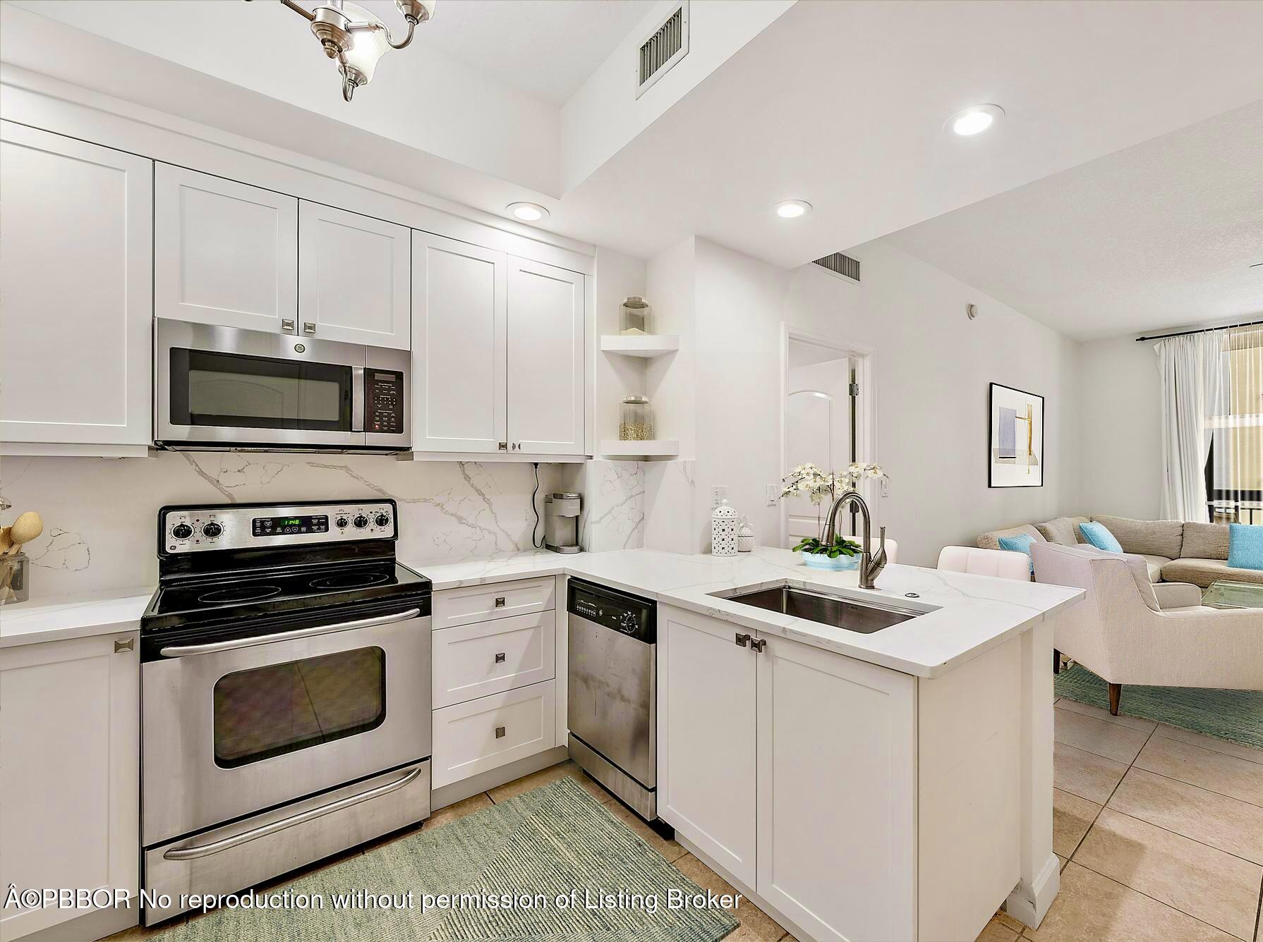 a kitchen with a sink stove and microwave