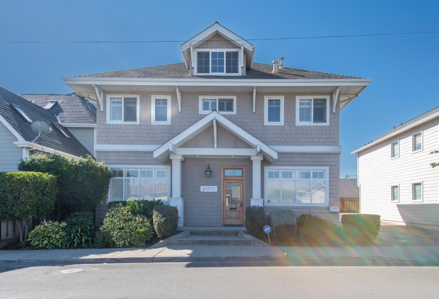 a front view of a house with garden