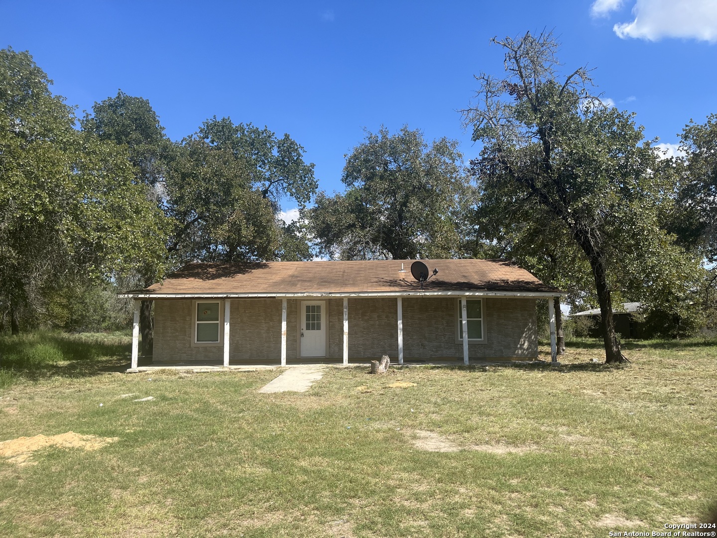 a house with trees in the background