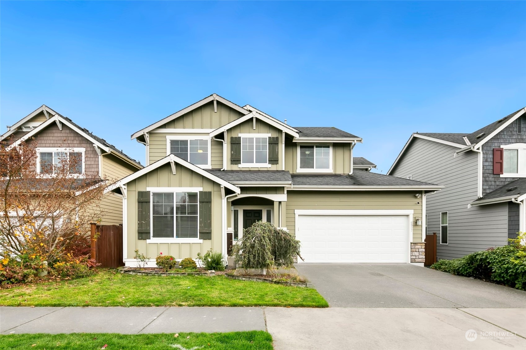 a front view of a house with a yard