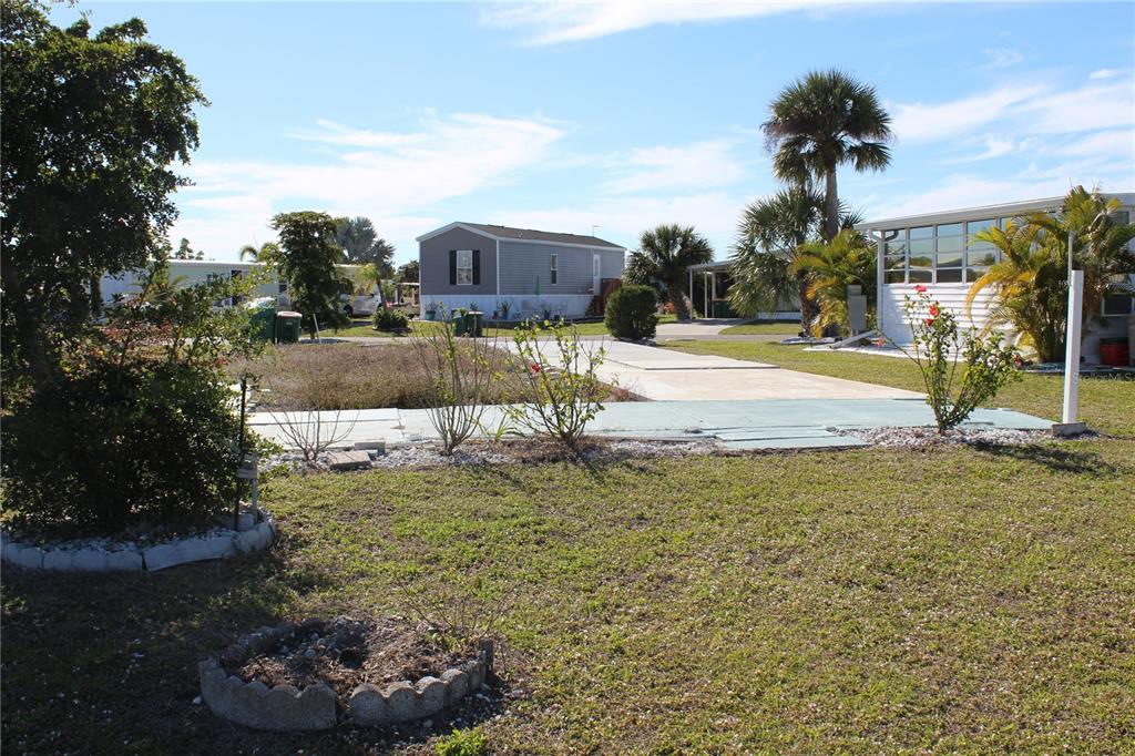 a view of a swimming pool with a yard