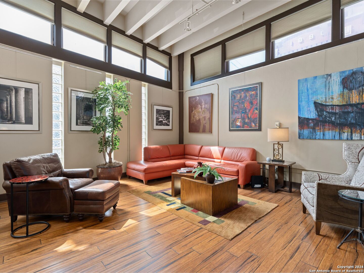 a living room with furniture or couch and a table