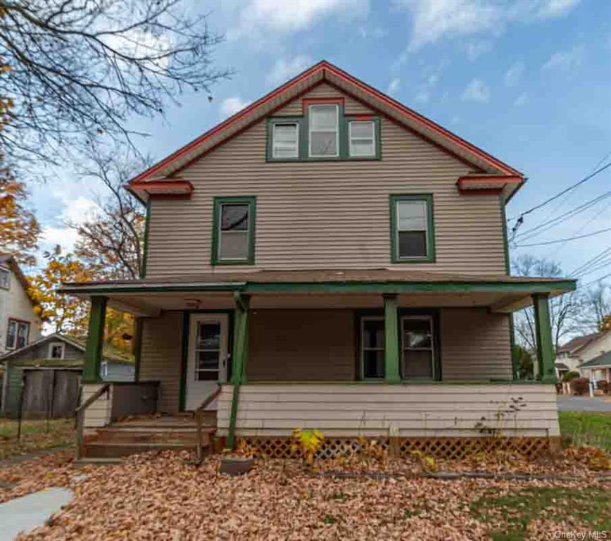 Back of house with covered porch