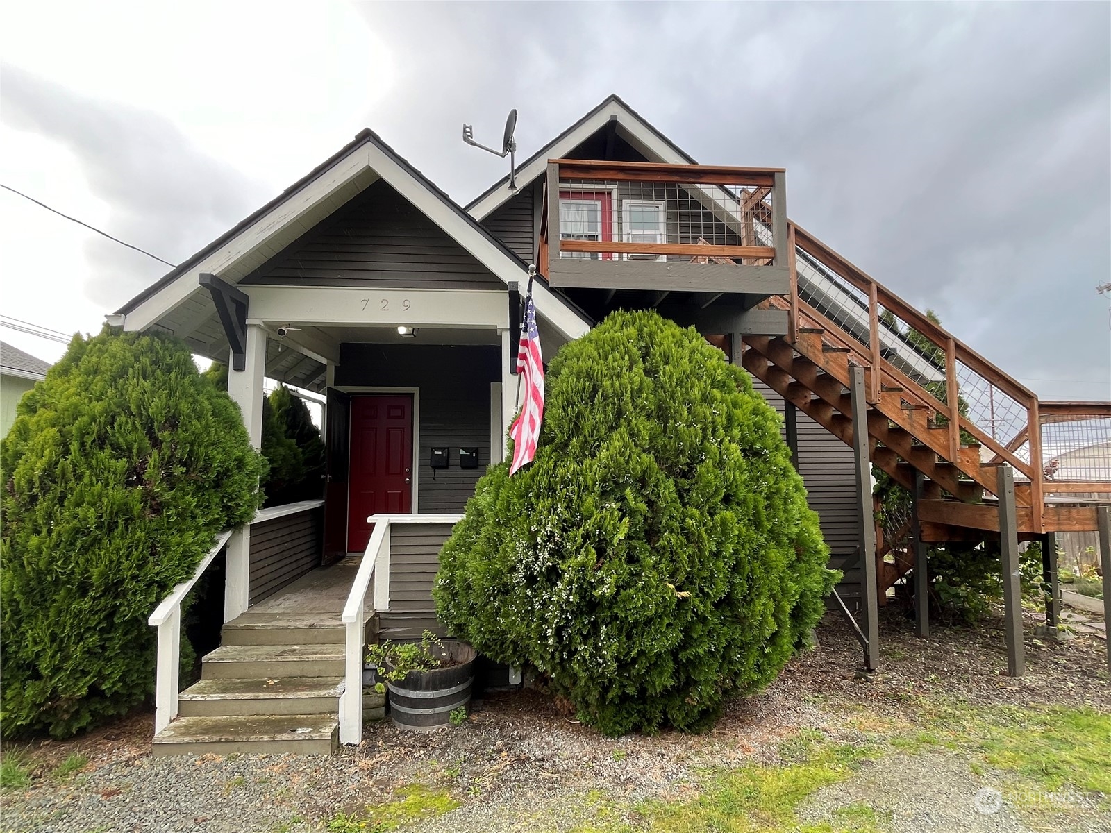 a front view of a house with a yard