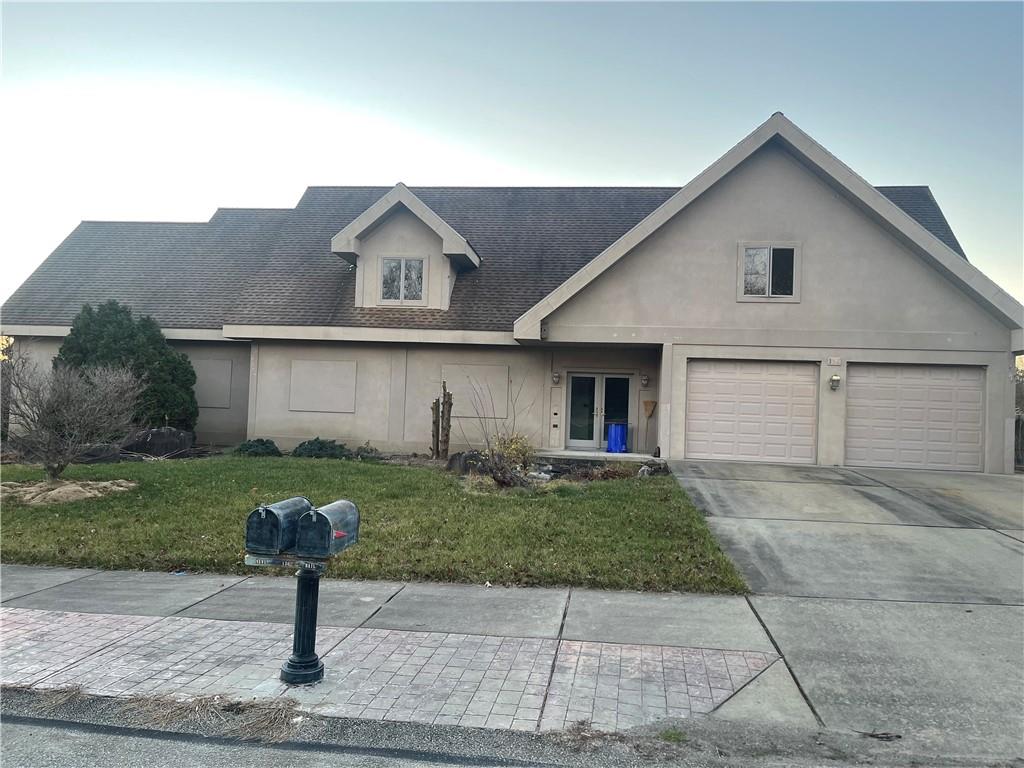 a front view of house with yard and outdoor seating