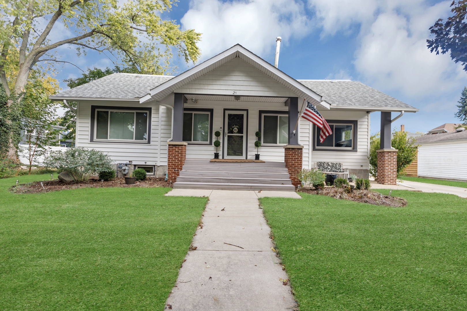 a front view of a house with garden