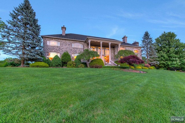 a front view of house with garden