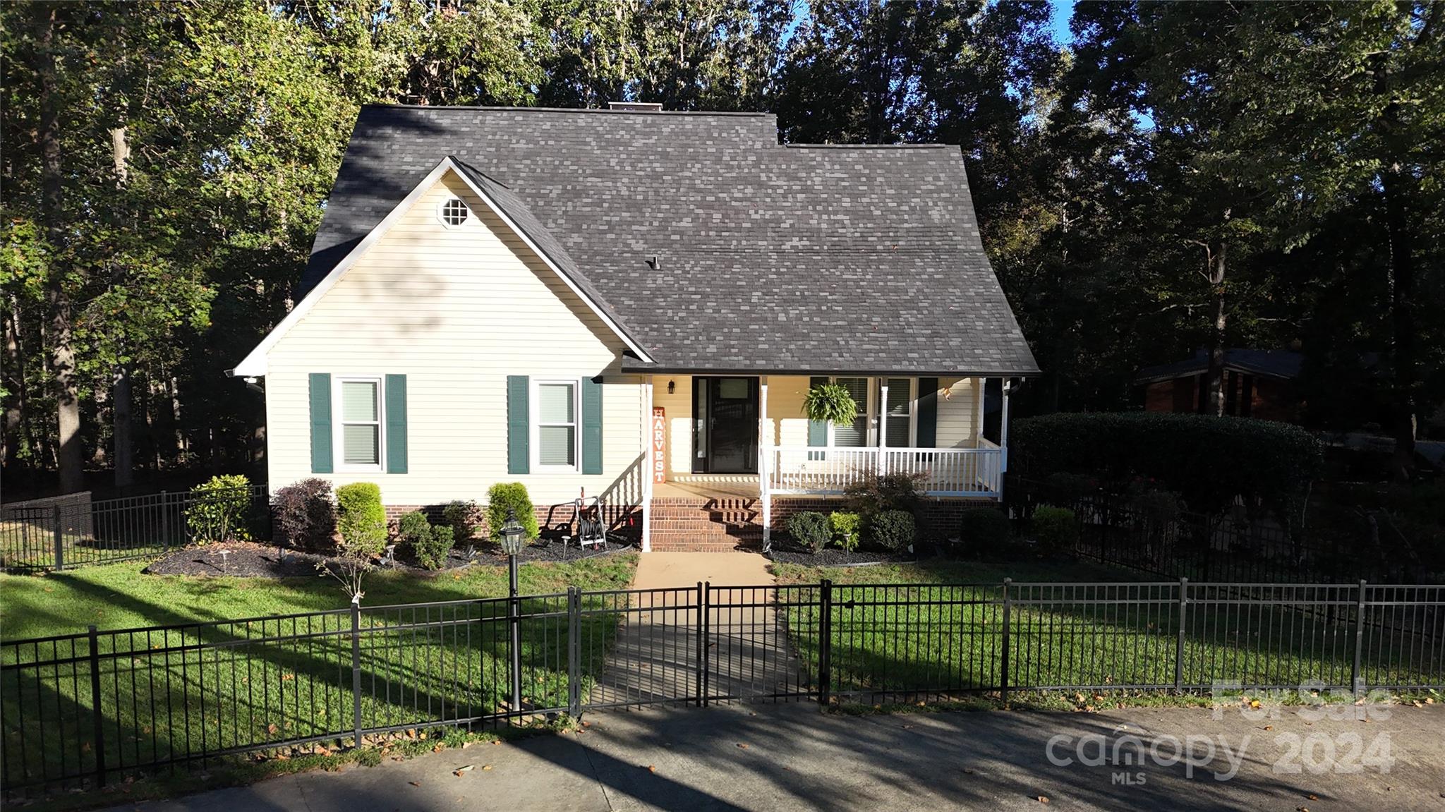 a view of a house with backyard sitting area and garden