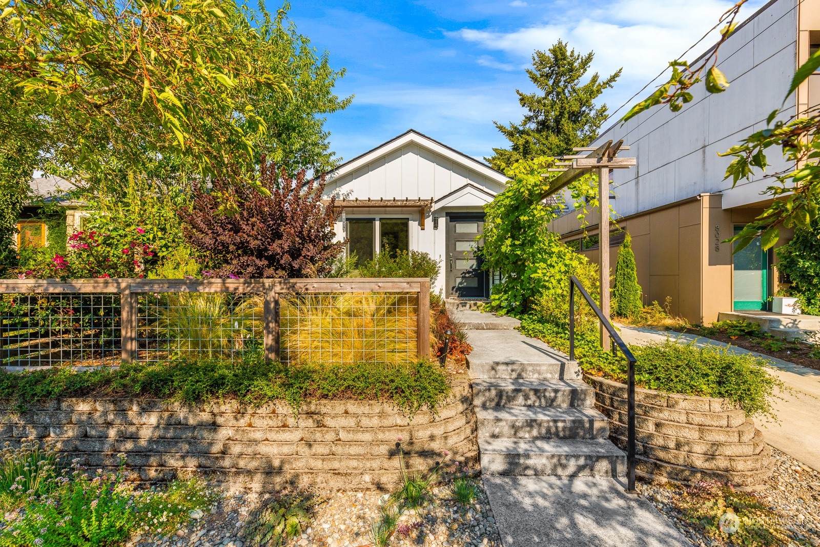 a front view of a house with garden