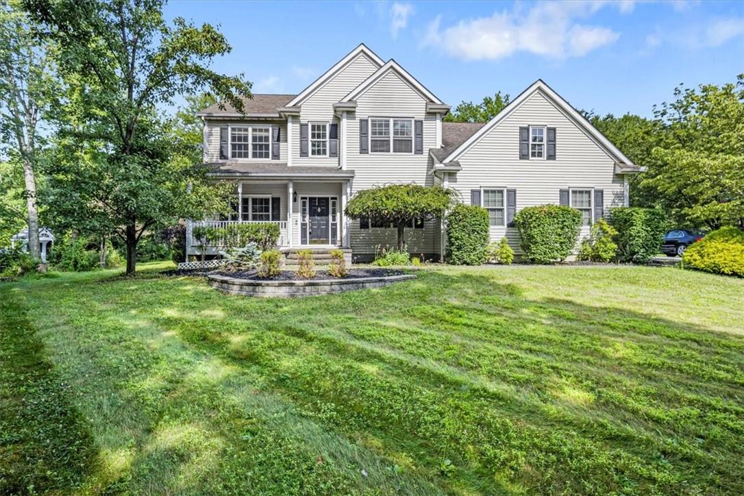 Front view of house featuring a lawn