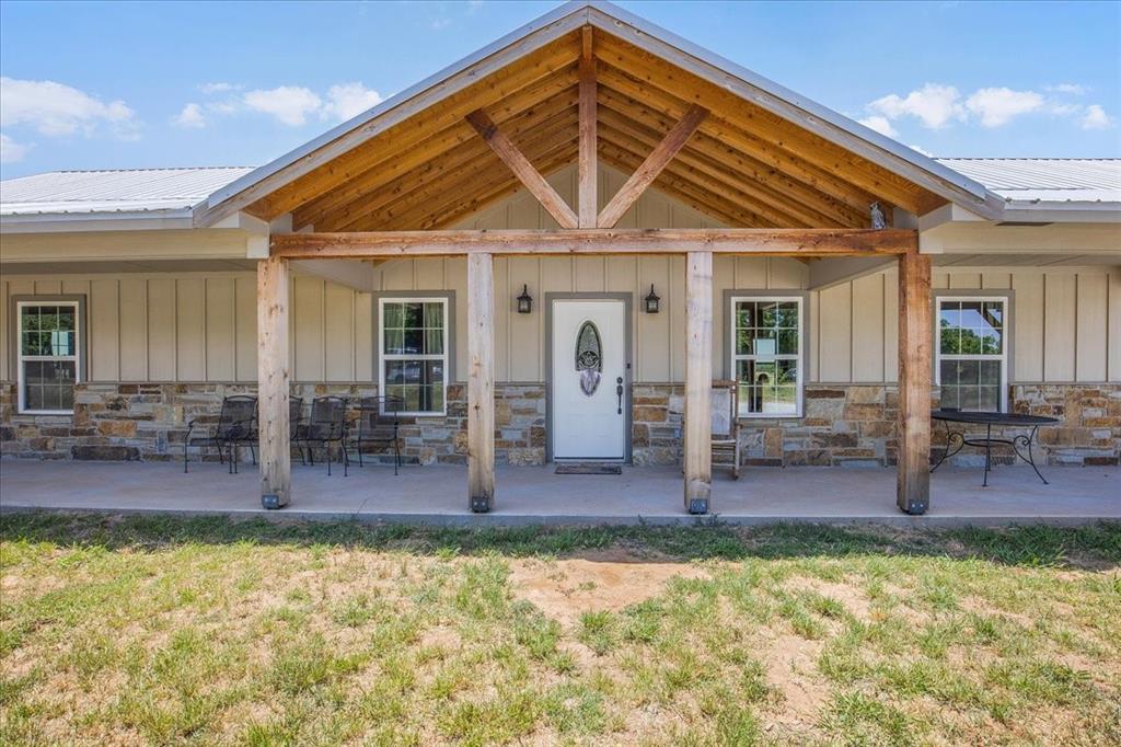 a front view of house with outdoor seating