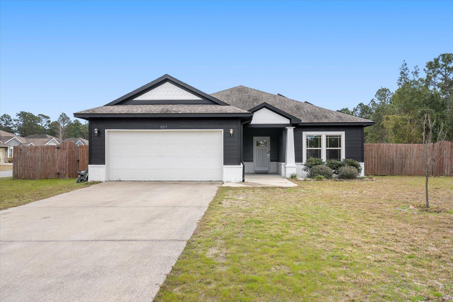 a front view of a house with yard