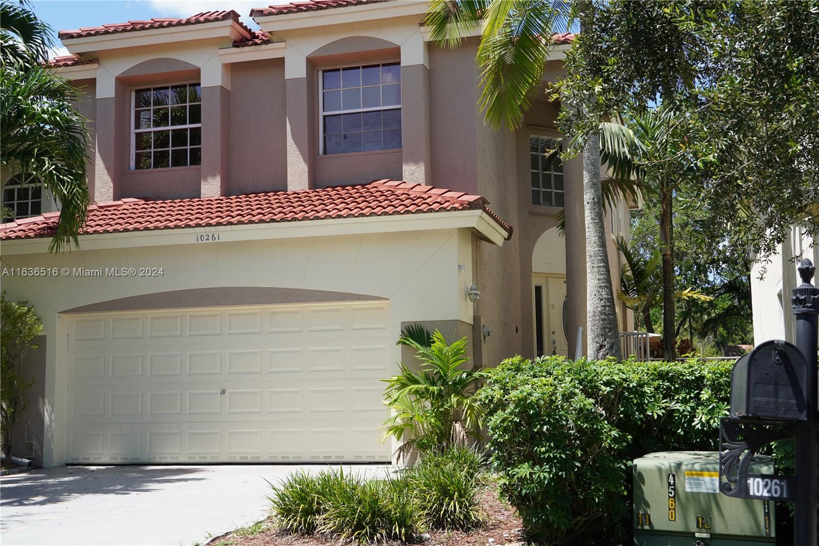 a front view of a house with a garage