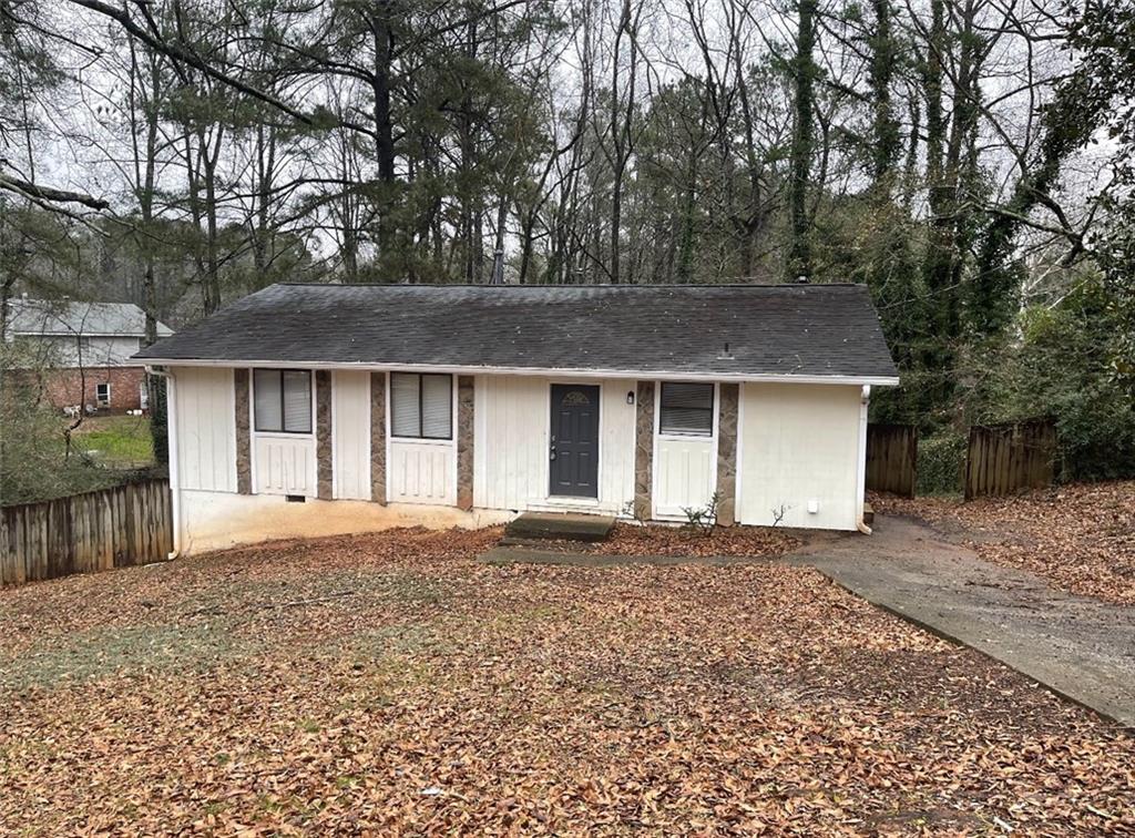 a house with trees in the background