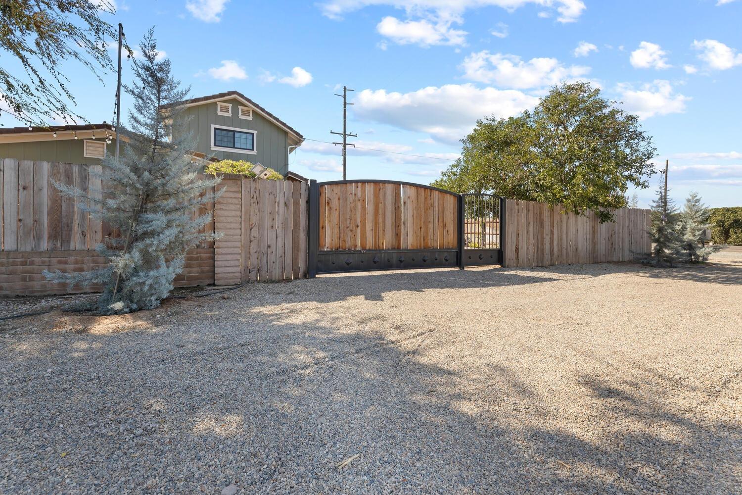 a front view of a house with a yard and a garage