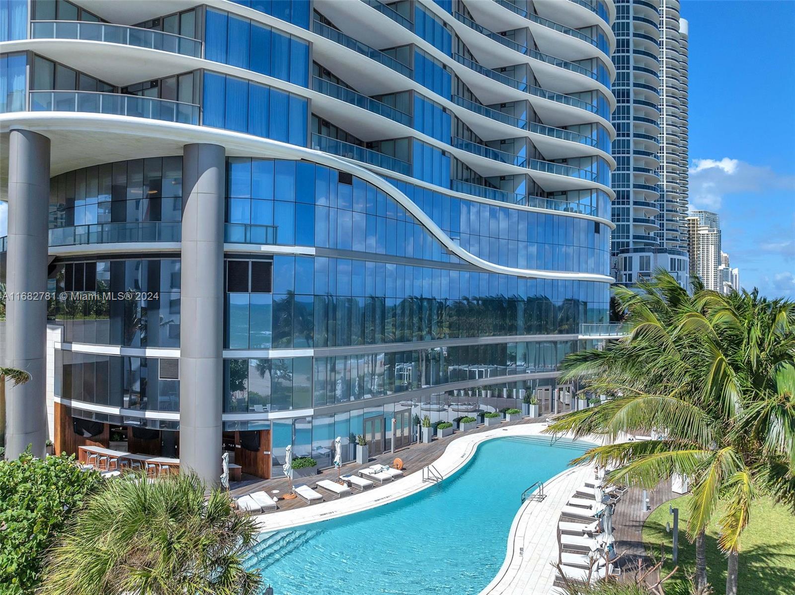 a view of a swimming pool with sitting area