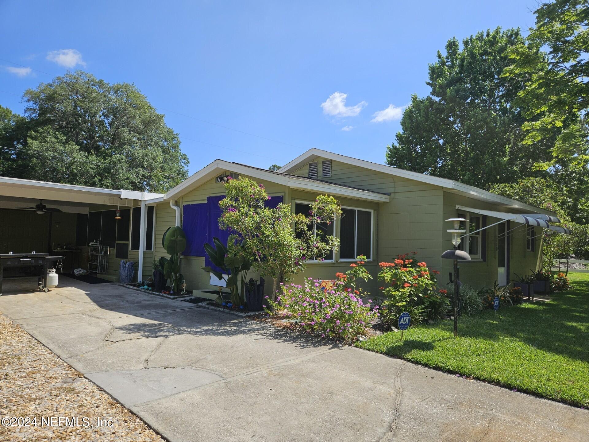 front view of a house with a yard