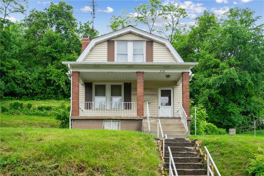 front view of a house with a yard