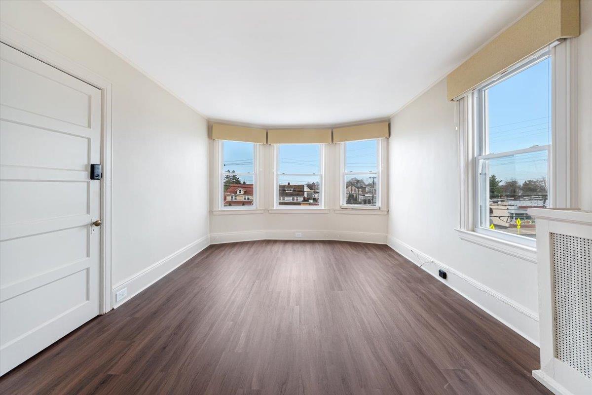 Living room with tall ceilings and bright south by southwest exposure.