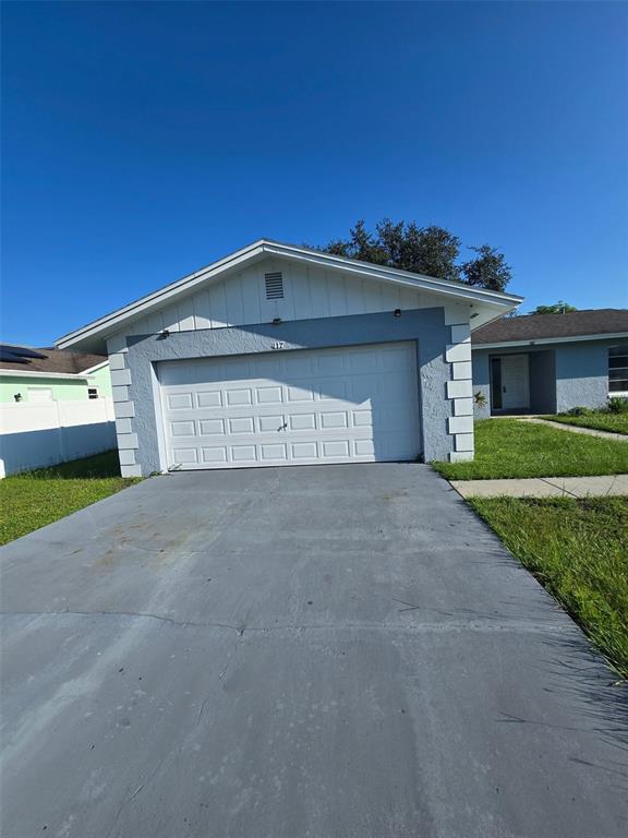 a front view of a house with a garage