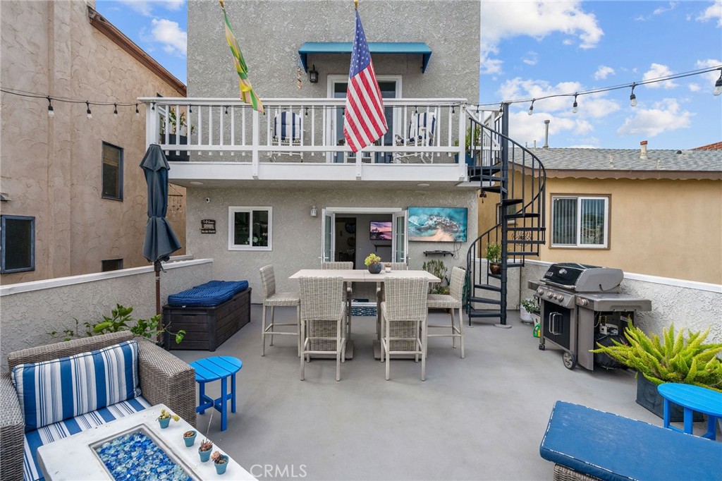 a view of a patio with table and chairs