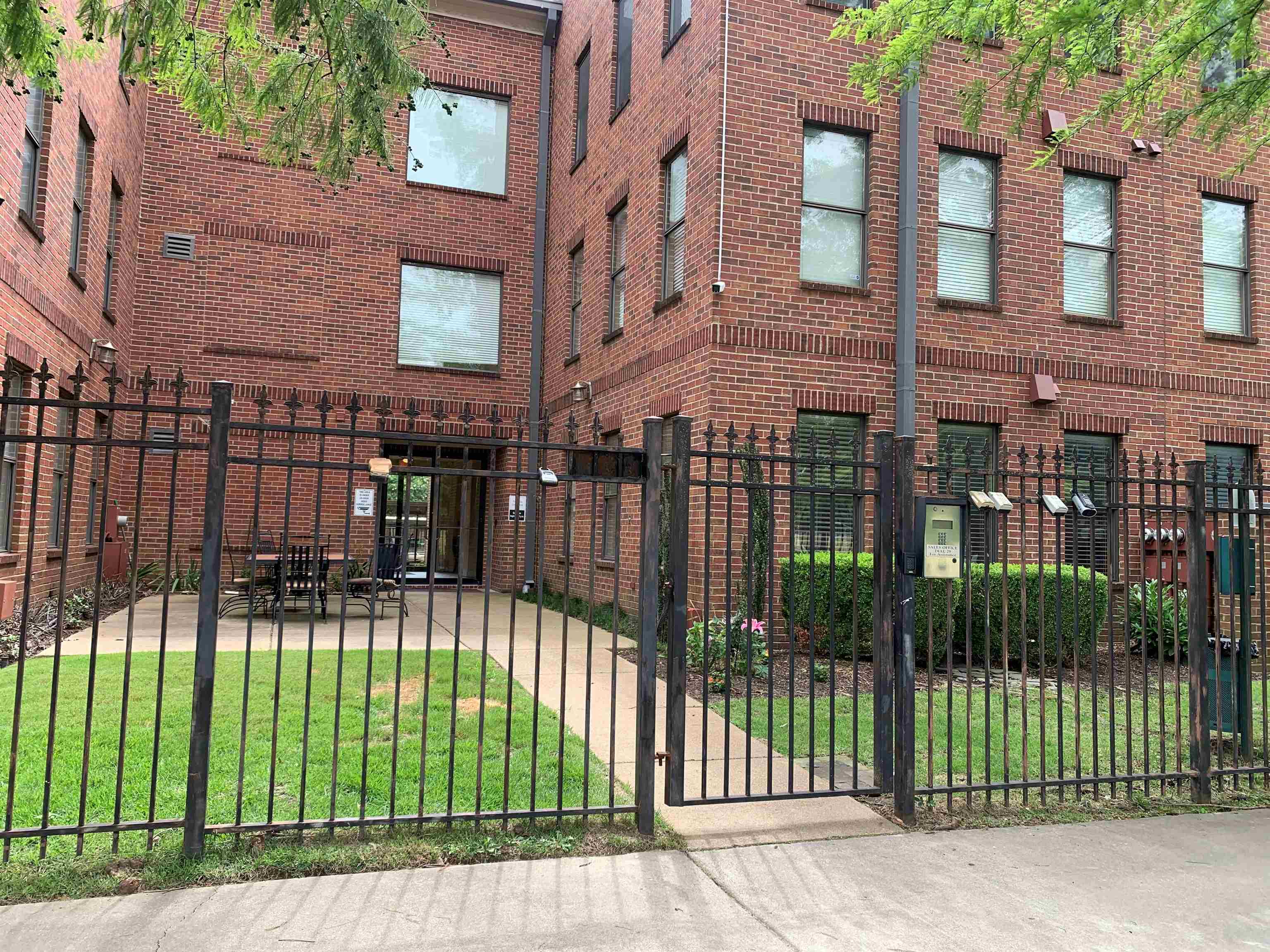 a view of a building with a garden area