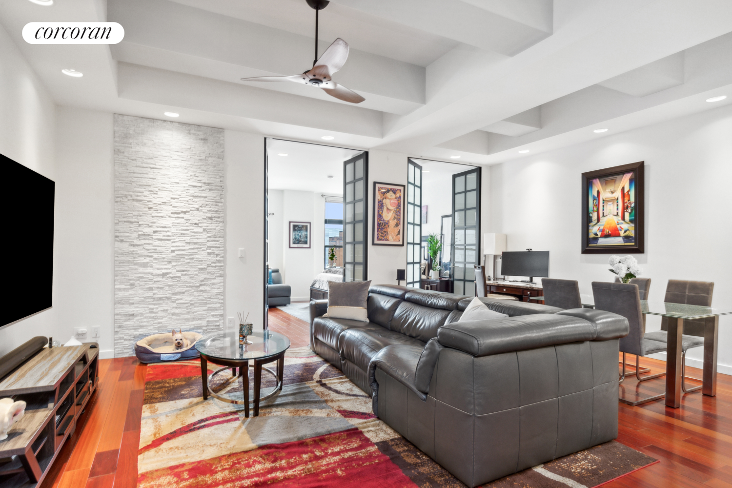 a living room with furniture and a flat screen tv