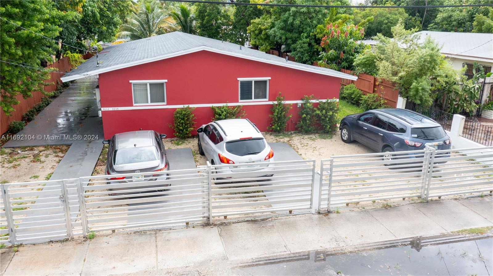 a view of a house with yard and sitting area