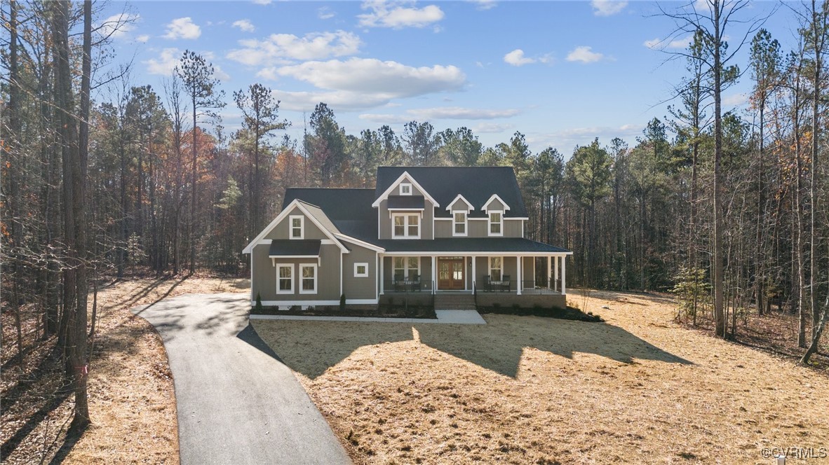 a view of a house with a snow in the background