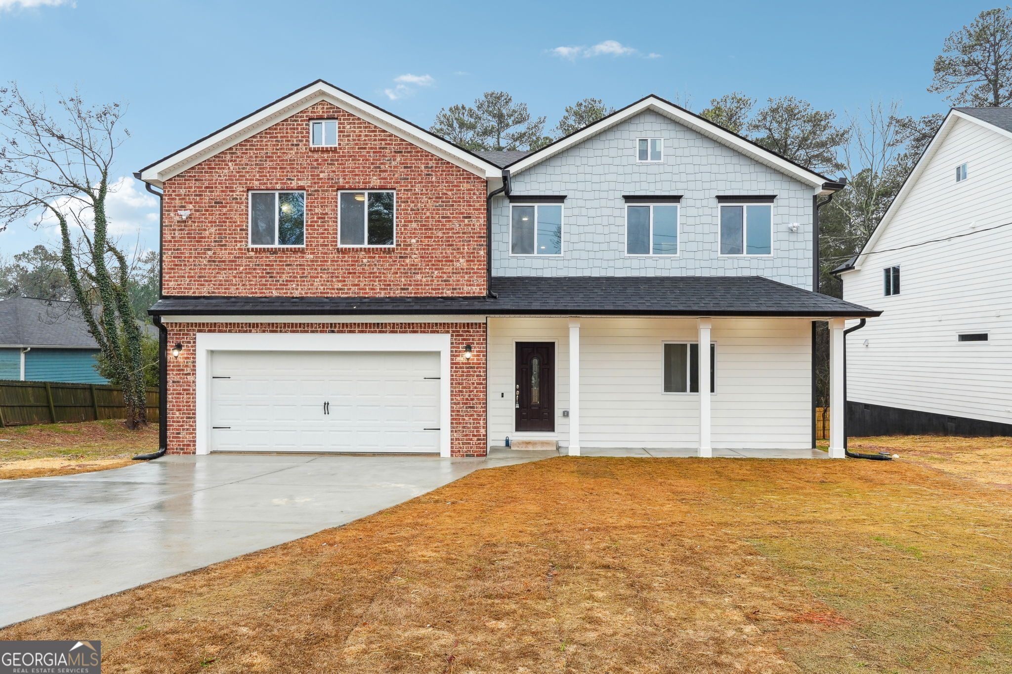 a front view of a house with a yard