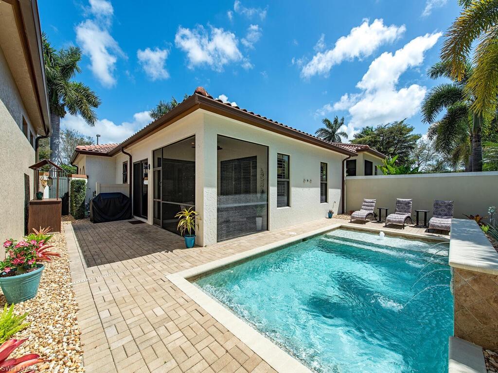 a view of a house with backyard and porch